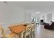 Open dining room with view to the living area at 5122 Northridge Rd # 112, Sarasota, FL 34238
