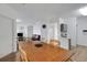 Open concept dining area with view to the kitchen and living area at 5122 Northridge Rd # 112, Sarasota, FL 34238