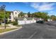 Attached garages provide convenient parking near this condo building with lush landscaping and ample parking spaces at 5122 Northridge Rd # 112, Sarasota, FL 34238