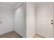 Apartment hallway with storage and front door at 5122 Northridge Rd # 112, Sarasota, FL 34238