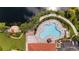 Aerial view of large community pool with surrounding lounge chairs and landscaping at 5509 Avellino Pl, Sarasota, FL 34238