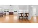 Open-concept dining room with water views, hardwood floors, and neutral colors at 5509 Avellino Pl, Sarasota, FL 34238