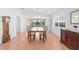 Inviting dining room with views of the pond and lush landscaping at 5509 Avellino Pl, Sarasota, FL 34238