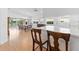 Charming kitchen with counter seating flowing to the living and dining areas at 5509 Avellino Pl, Sarasota, FL 34238