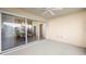 Enclosed patio featuring serene views and seamless access to the dining area with sliding glass doors at 5509 Avellino Pl, Sarasota, FL 34238