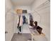 Organized walk-in closet with shelving, clothing racks, and a workstation at 5547 Logan Cave Ave, Wimauma, FL 33598