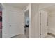 Hallway with access to a bedroom and bathroom at 5547 Logan Cave Ave, Wimauma, FL 33598
