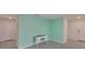 Comfortable office space with a light blue accent wall and tile flooring at 5547 Logan Cave Ave, Wimauma, FL 33598
