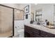 Full bathroom featuring granite countertops and a tiled walk-in shower at 5609 Arnie Loop, Lakewood Ranch, FL 34211