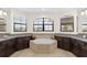 Bathroom showcasing a large soaking tub with tile surround and granite countertops at 5609 Arnie Loop, Lakewood Ranch, FL 34211