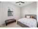 Cozy bedroom featuring a rustic wooden bed frame and a leather bench at 5609 Arnie Loop, Lakewood Ranch, FL 34211