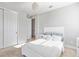 Neutral bedroom features plush carpeting and white walls and furniture with ample natural light at 5609 Arnie Loop, Lakewood Ranch, FL 34211