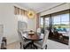 Dining area boasts natural light and views to the patio and golf course beyond at 5609 Arnie Loop, Lakewood Ranch, FL 34211