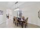 Traditional dining room featuring a modern chandelier and neutral color palette at 5609 Arnie Loop, Lakewood Ranch, FL 34211