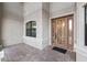 Bright entryway featuring a decorative front door and tile flooring at 5609 Arnie Loop, Lakewood Ranch, FL 34211