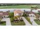 Beautiful home with a gorgeous tile roof, lake view, and mature landscaping in an upscale golf community at 5609 Arnie Loop, Lakewood Ranch, FL 34211