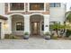 Inviting front entrance with elegant stone accents and a decorative front door at 5609 Arnie Loop, Lakewood Ranch, FL 34211