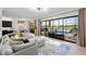 Spacious living room featuring a sectional sofa, large windows, and views of the pool at 5609 Arnie Loop, Lakewood Ranch, FL 34211