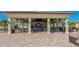 Open-air pool bar with ample seating, overhead fans and exterior views at 5609 Arnie Loop, Lakewood Ranch, FL 34211