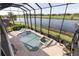 Screened lanai with a beautiful pool and spa overlooking a serene golf course and pond view at 5609 Arnie Loop, Lakewood Ranch, FL 34211
