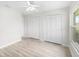 This spacious bedroom features new floors, bright white walls, and double closets at 5689 Evergreen Dr # 18, Sarasota, FL 34233