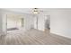 Spacious bedroom with new floors and fresh paint, featuring entry to en suite bathroom and walk-in closet at 5689 Evergreen Dr # 18, Sarasota, FL 34233
