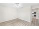 A bright bedroom leads to a modern kitchen with stainless steel appliances at 5689 Evergreen Dr # 18, Sarasota, FL 34233