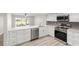 Modern kitchen featuring stainless steel appliances and quartz countertops at 5689 Evergreen Dr # 18, Sarasota, FL 34233