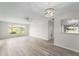 Open-concept living area with modern flooring and ample natural light at 5689 Evergreen Dr # 18, Sarasota, FL 34233