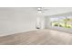 Bright living room featuring modern flooring and ample natural light at 5689 Evergreen Dr # 18, Sarasota, FL 34233
