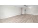 Spacious living room with modern flooring and a ceiling fan at 5689 Evergreen Dr # 18, Sarasota, FL 34233