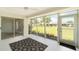 A covered patio with large windows provides beautiful backyard views at 5689 Evergreen Dr # 18, Sarasota, FL 34233