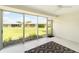 A screened-in patio has bright, oversized windows offering serene backyard views at 5689 Evergreen Dr # 18, Sarasota, FL 34233