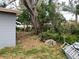 Spacious backyard with mature trees and partial view of the home's exterior at 6324 Case Ave, Bradenton, FL 34207