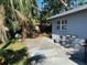 Backyard featuring palm trees and cracked patio at 6324 Case Ave, Bradenton, FL 34207