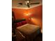Cozy bedroom with a closet, a window, and a simple bed setup with red pillows at 6324 Case Ave, Bradenton, FL 34207