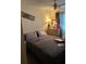 Cozy bedroom with cream colored walls, patterned curtains, and a neutral bed at 6324 Case Ave, Bradenton, FL 34207