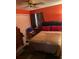 Cozy bedroom with a closet, a window, and a simple bed setup with red pillows at 6324 Case Ave, Bradenton, FL 34207
