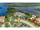 Beautiful aerial view of waterfront community with club house, marina, and lush landscaping at 643 Misty Pond Ct, Bradenton, FL 34212