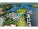 Majestic aerial view showcases the private pool, marina, and residences within this luxurious waterfront community at 643 Misty Pond Ct, Bradenton, FL 34212