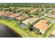 Gorgeous aerial view of the homes, golf course, and tranquil pond at 643 Misty Pond Ct, Bradenton, FL 34212