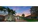 Charming single-story home with a brick driveway, a two-car garage, and palm trees at 643 Misty Pond Ct, Bradenton, FL 34212