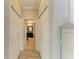 Hallway leading to the bathroom with closet space on both sides at 643 Misty Pond Ct, Bradenton, FL 34212