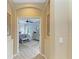 Hallway leading to bedroom with decor at 643 Misty Pond Ct, Bradenton, FL 34212