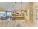 Bright kitchen with granite countertops, stainless steel appliances, and adjacent dining area with natural light at 643 Misty Pond Ct, Bradenton, FL 34212