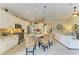 Open kitchen with granite countertops, stainless appliances, and adjacent living area at 643 Misty Pond Ct, Bradenton, FL 34212