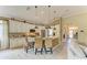 Well-equipped kitchen with a center island, white cabinetry, and a seamless flow into the living area at 643 Misty Pond Ct, Bradenton, FL 34212