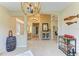 Spacious living room featuring tile floors, high ceilings, and elegant lighting at 643 Misty Pond Ct, Bradenton, FL 34212