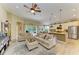 Spacious living room with open floor plan, view of the backyard, and seamless access to the kitchen at 643 Misty Pond Ct, Bradenton, FL 34212