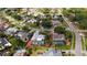 Aerial view of a home with a screened-in pool in a residential neighborhood at 6583 Waterford Cir, Sarasota, FL 34238